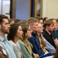 students sitting at event